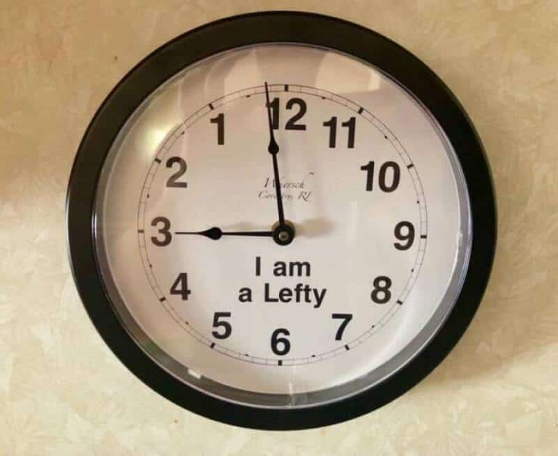 "Clock showing 12:00 with the text 'I am a Lefty' on the face".