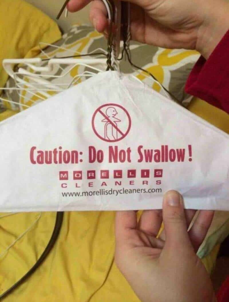 Caution: Do Not Swallow! Morellis Cleaners face mask with warning symbol.