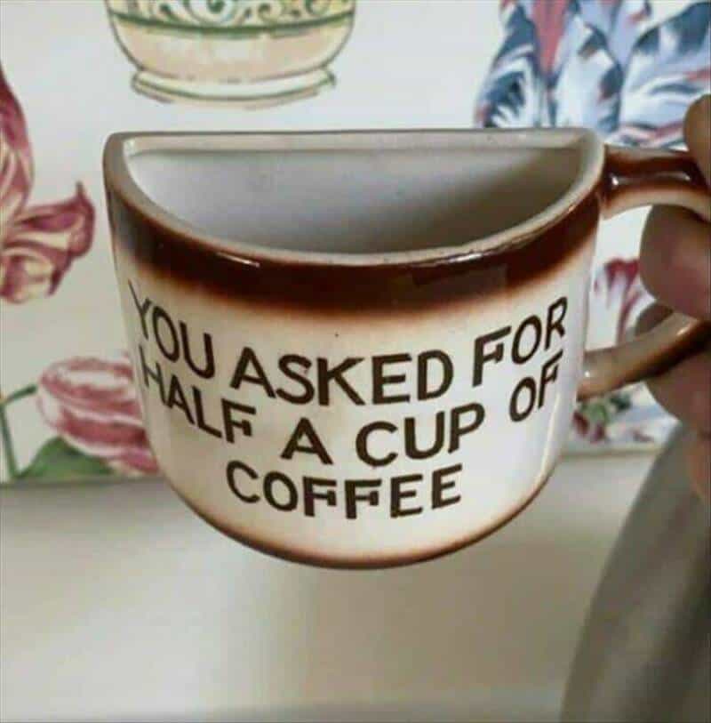 "Coffee mug with humorous text: 'You asked for half a cup of coffee'.".