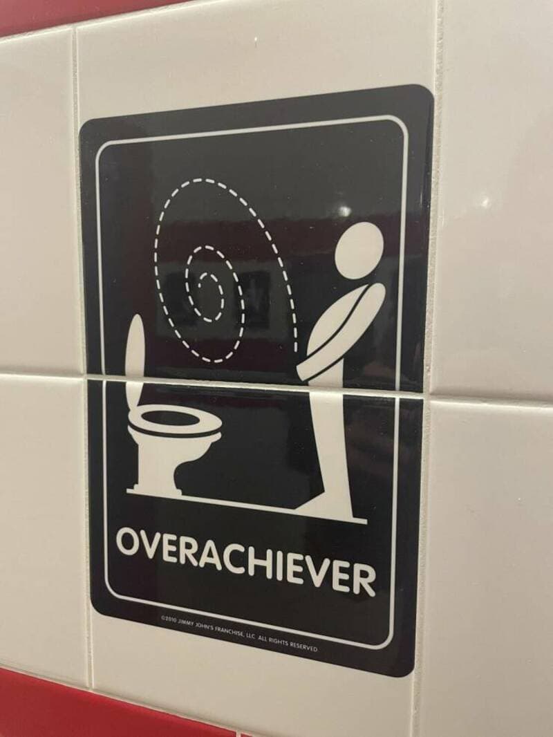 Spinning toilet with a person and a spiral above, labeled "OVERACHIEVER" in black and white.