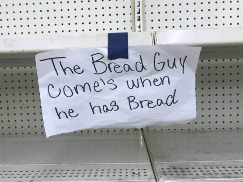 "Sign reading: The Bread Guy comes when he has bread".