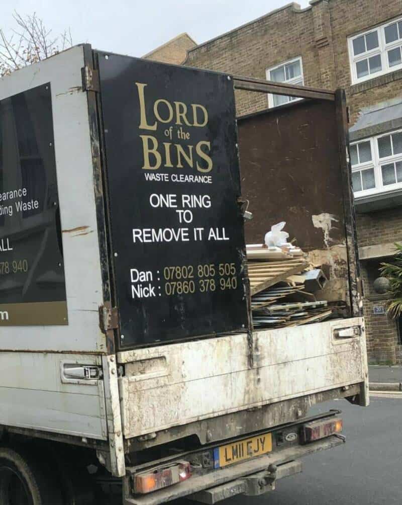 Waste clearance truck with "Lord of the Bins" sign and contact info on the side.