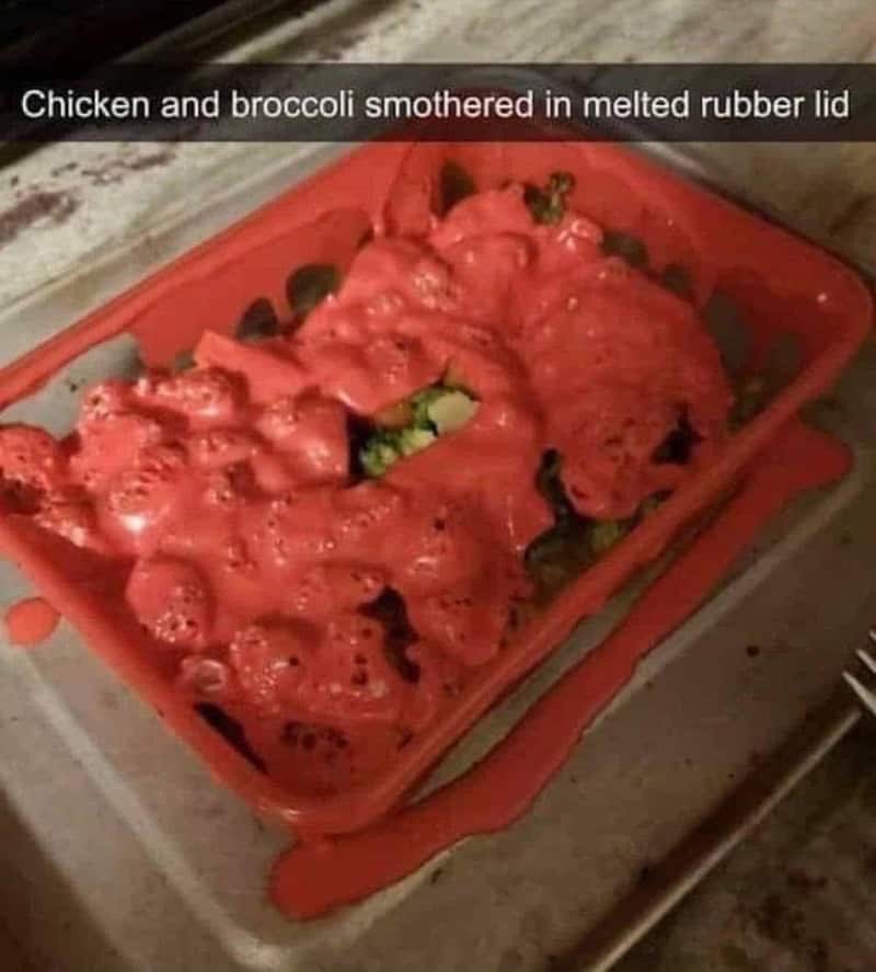 Chicken and broccoli smothered in melted rubber lid in a red container.