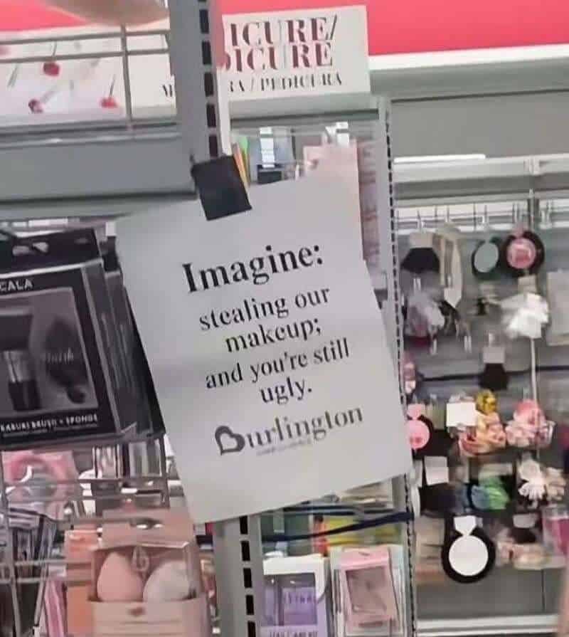 Sign in store reads 'Imagine: stealing our makeup; and you're still ugly. Burlington'.