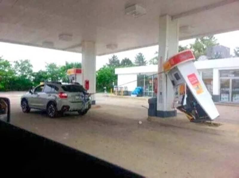 Gas station with a toppled and tilted vending machine or kiosk.