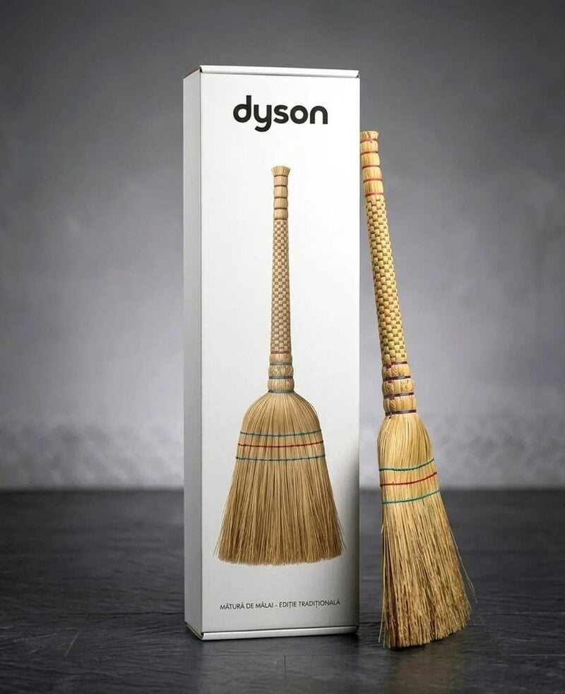 Humorous broomstick with a Dyson box, resembling a traditional broom.