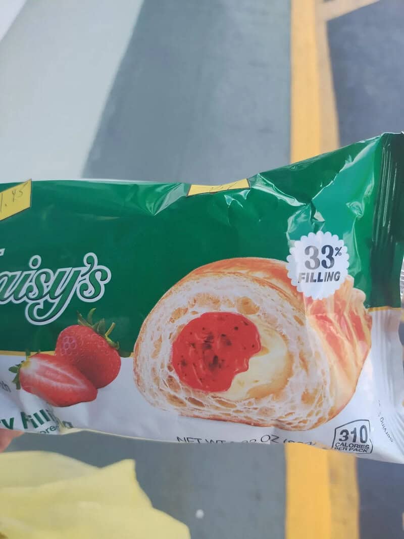 Packaged pastry with strawberry and cream filling, 33% filling, on a shopping cart.
