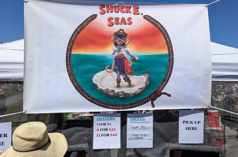 Sign for 'Shuck E. Seas' with a cartoon pirate octopus on an island.
