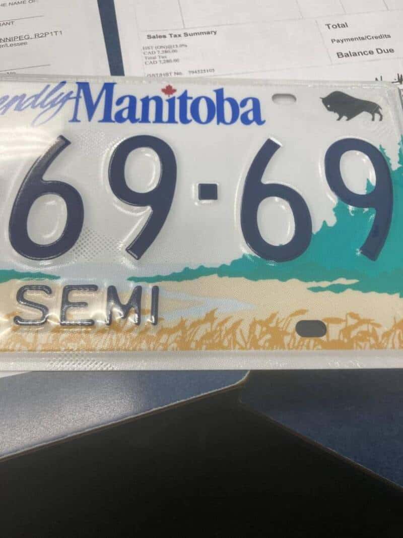 Manitoba license plate with number 69-69 and SEMI label, black buffalo silhouette.