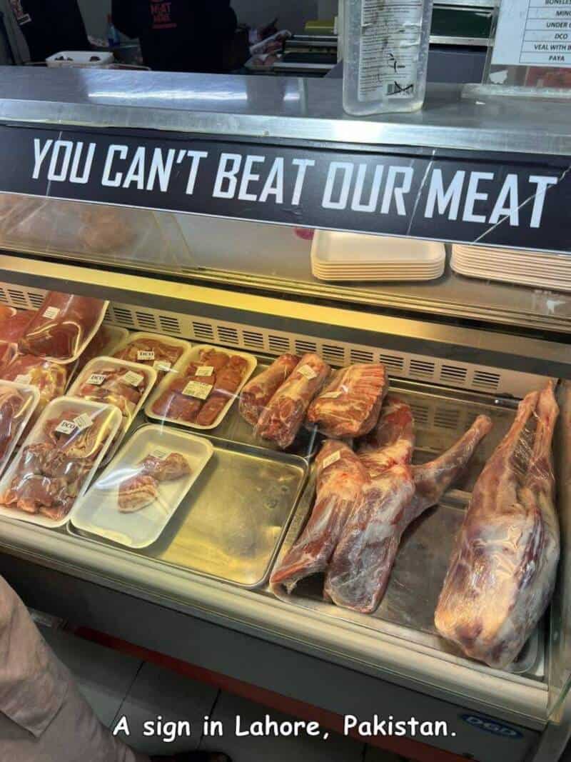 Sign in Lahore, Pakistan says 'You can't beat our meat' with meat products below.