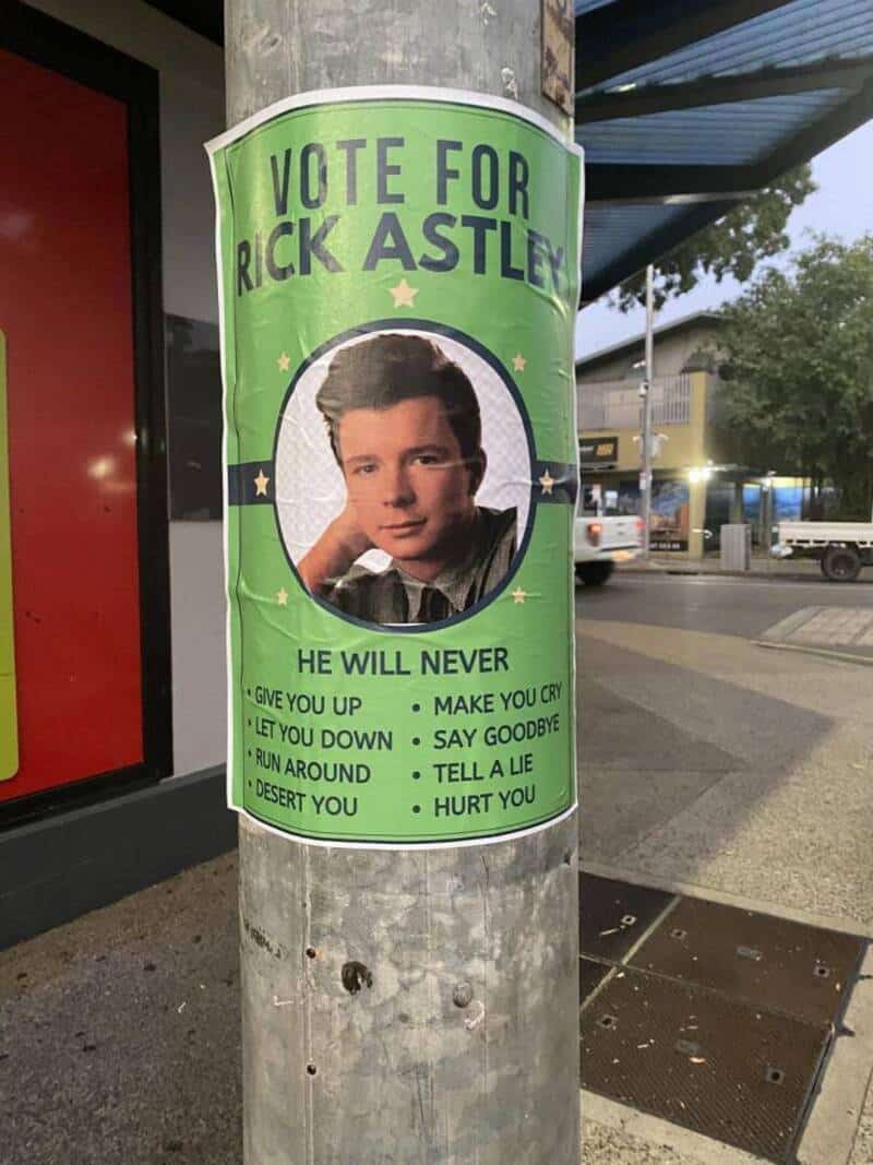 Vote for Rick Astley poster with his photo and lyrics from 'Never Gonna Give You Up'.