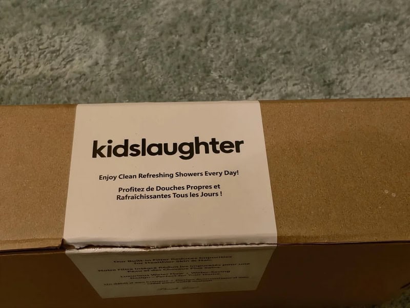 Kidslaughter shower product box with humorous text in English and French.