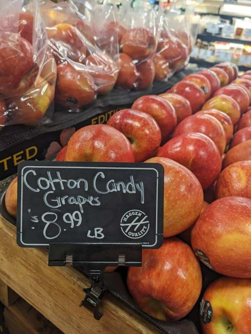 Cotton Candy Grapes on display with a price of $8.99 per pound.
