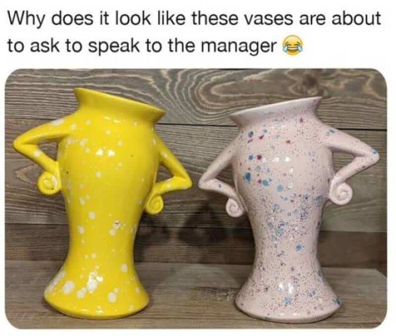 Yellow vase with arms and splattered white paint, pink vase with arms and blue splatters, both on wo.