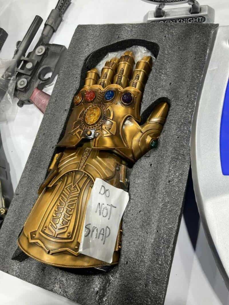 Replica of Thanos' Infinity Gauntlet with colored stones on a foam hand display.