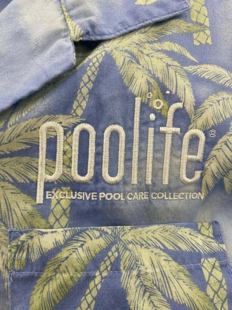 Poolife logo on fabric with palm tree design, part of the exclusive pool care collection.
