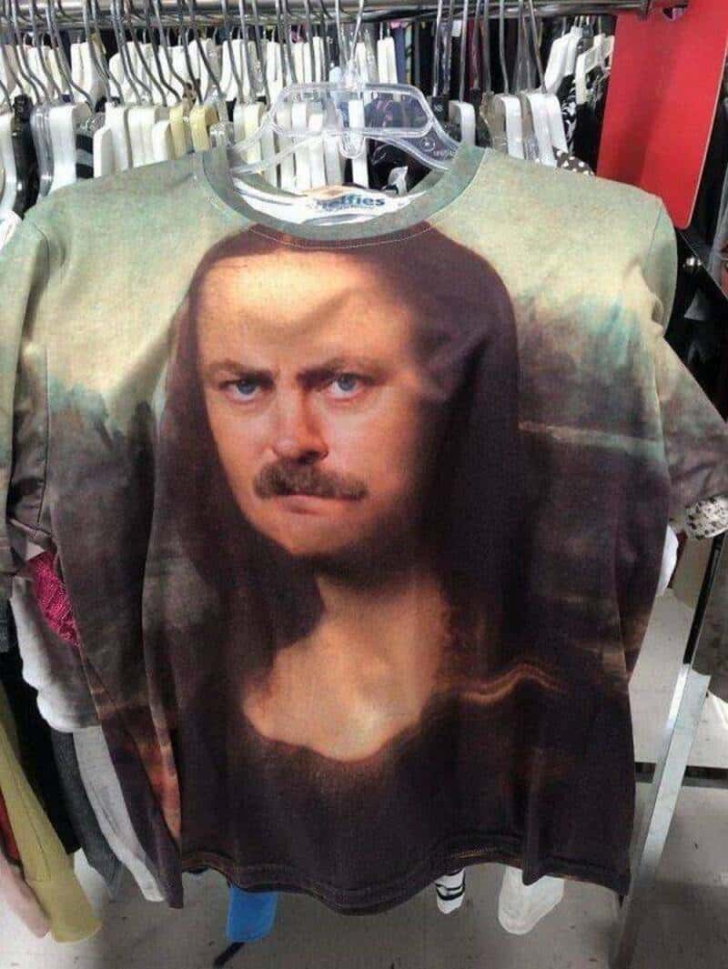 T-shirt with a printed image of a man's face, mustache, and serious expression.