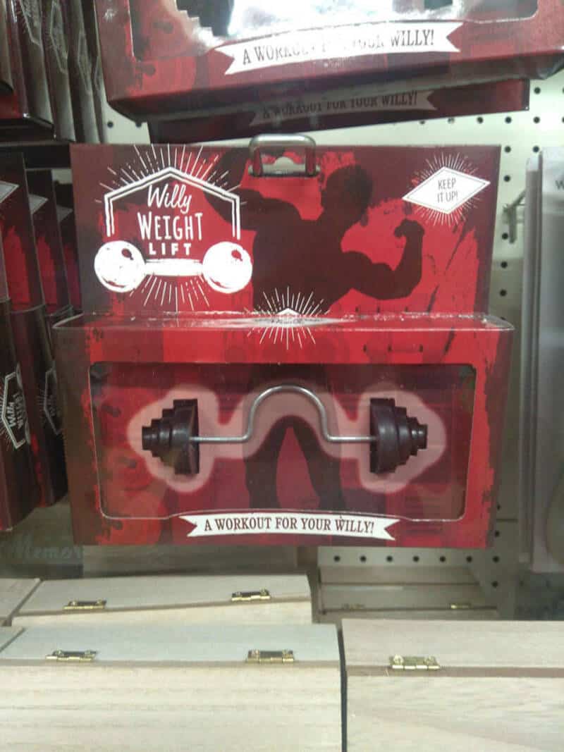 Willy Weight Lift toy with a barbell, in red packaging on store shelf.