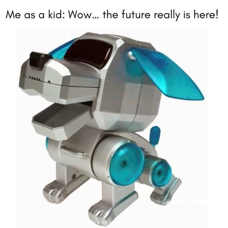 Robot dog with a blue tail and ears, captioned 'Me as a kid: Wow... the future really is here!'.