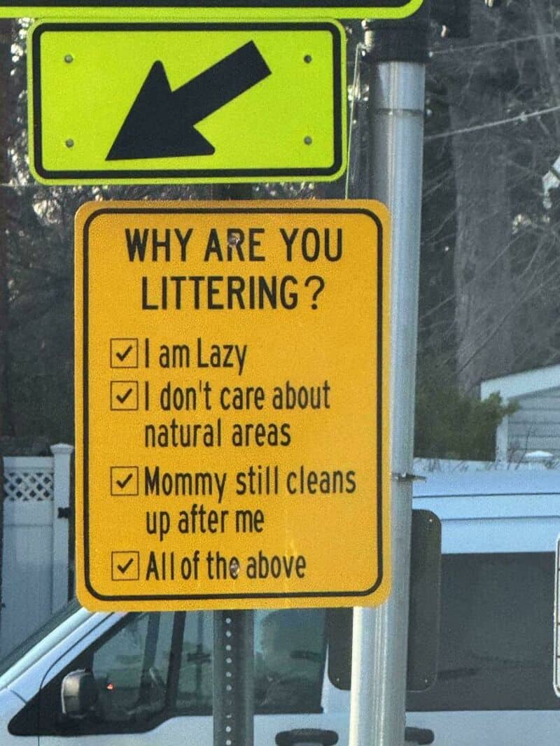 Littering warning sign with humorous reasons for not littering, including "I am Lazy" and "Mommy sti.
