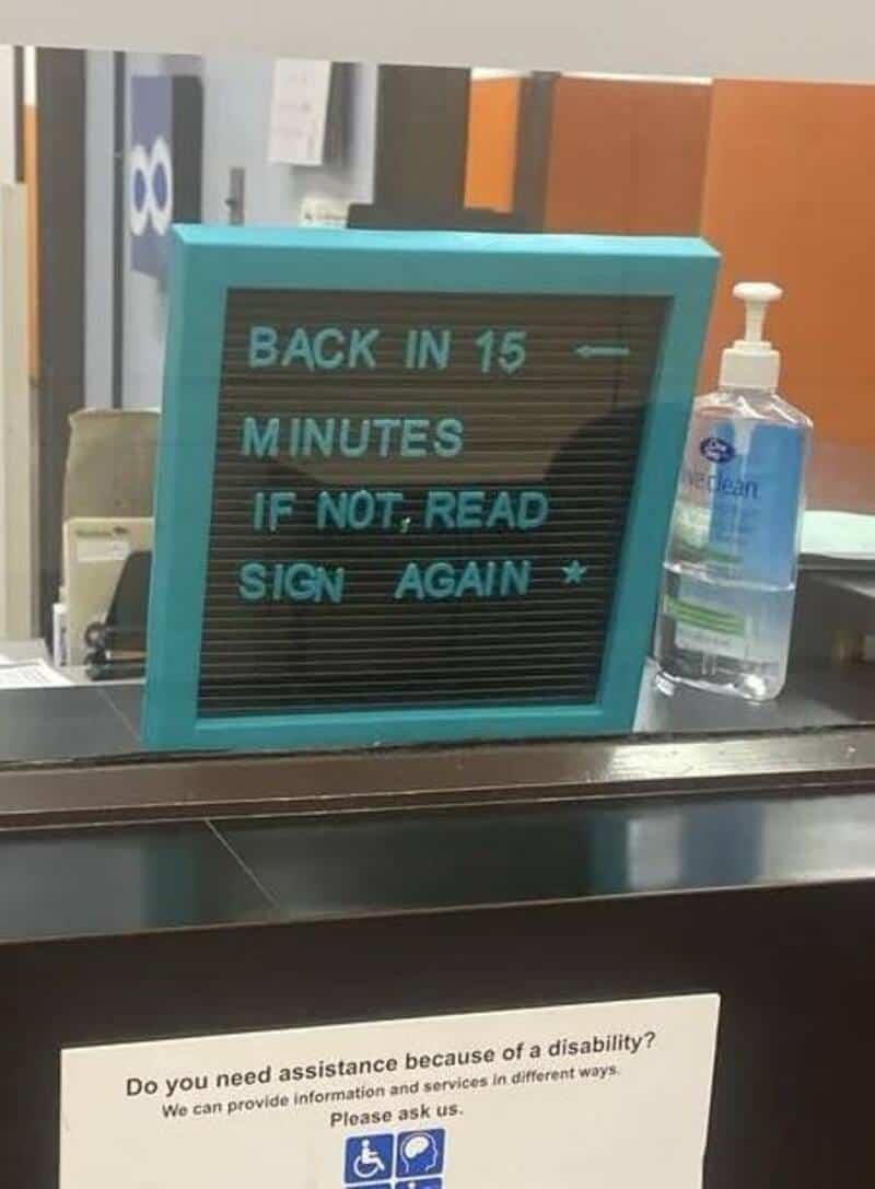 "Back in 15 minutes if not read, sign again" on a teal signboard.