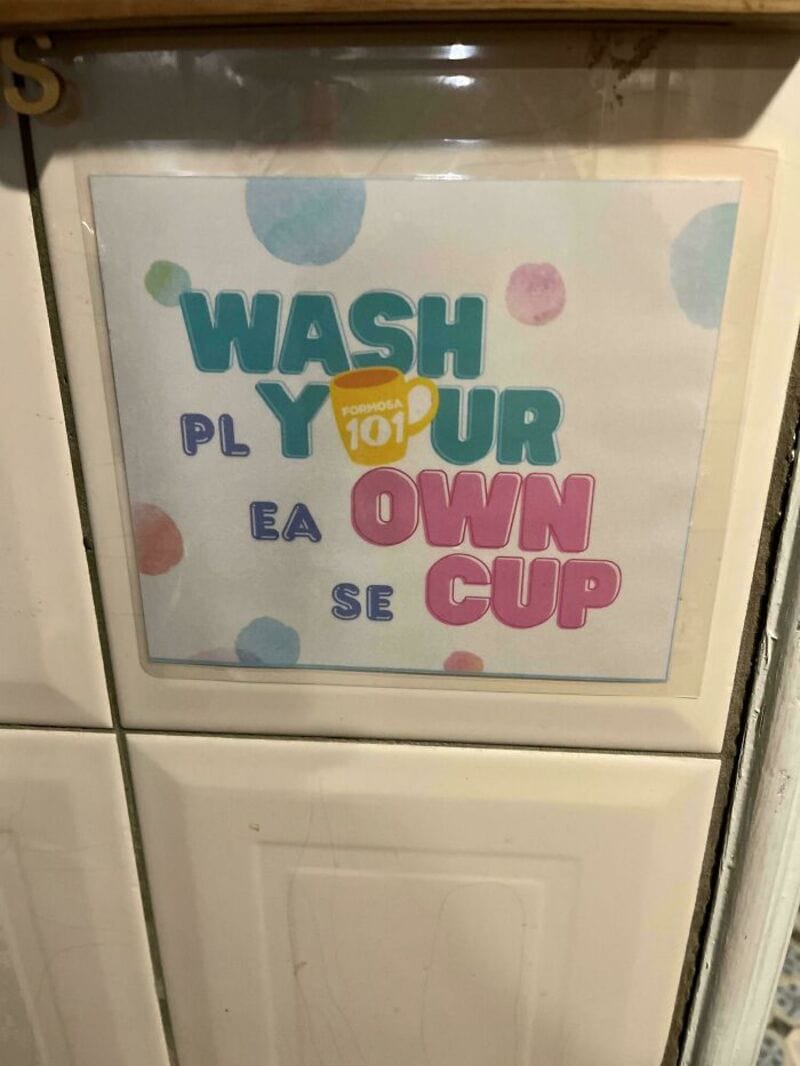 Wash your own cup sign with colorful text and polka dots.