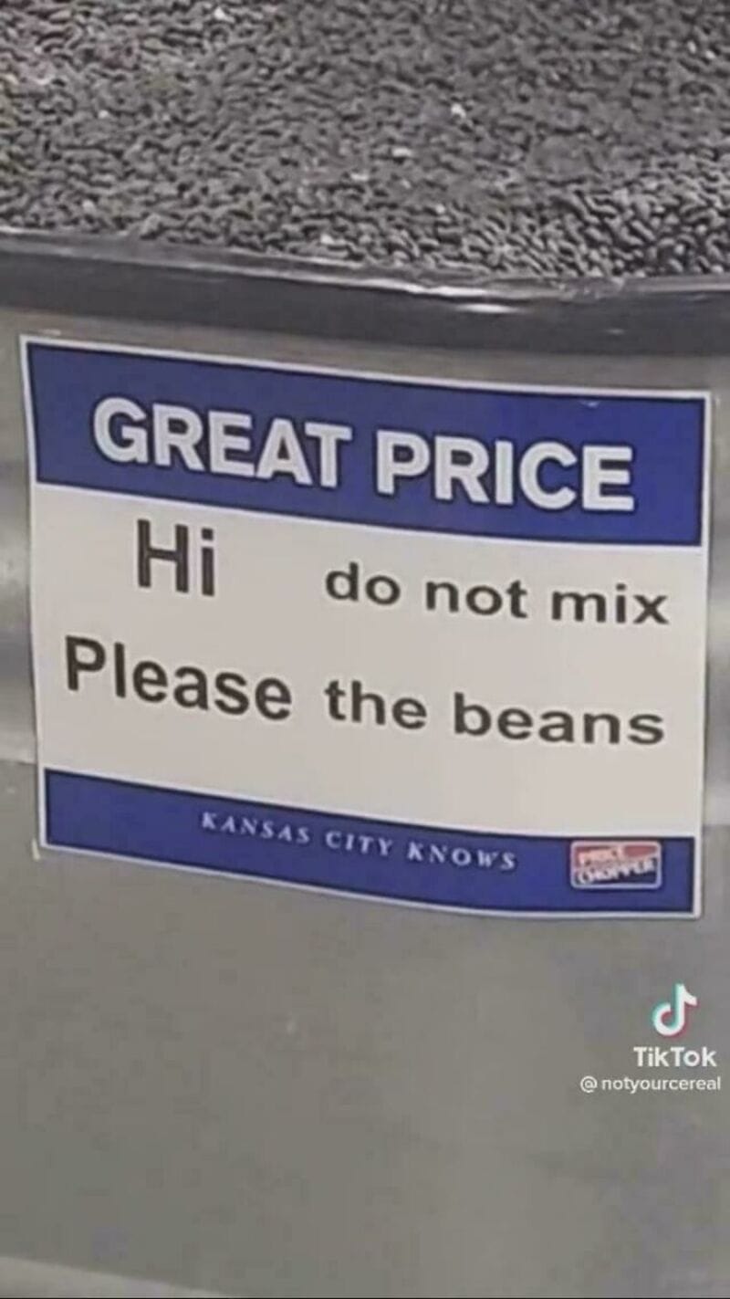 Sign reads 'GREAT PRICE Hi do not mix Please the beans Kansas City knows'.