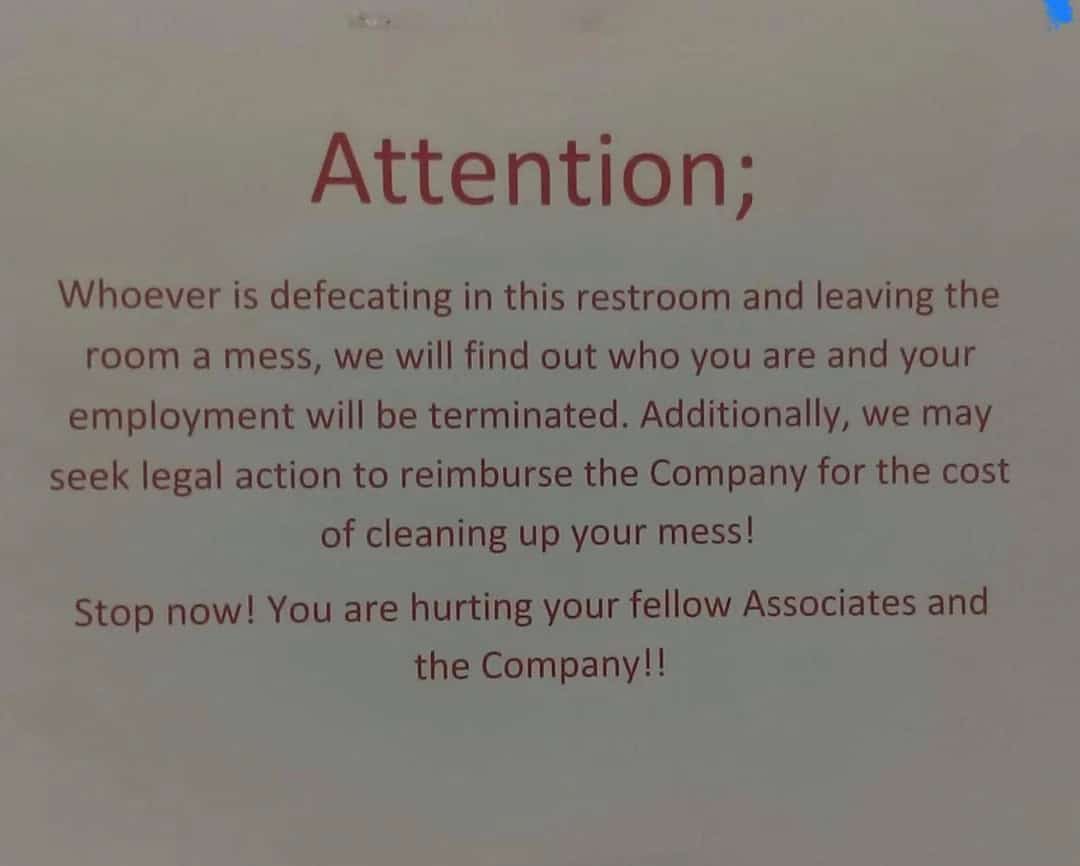 Warning sign about restroom mess and consequences for defecating in the wrong place.