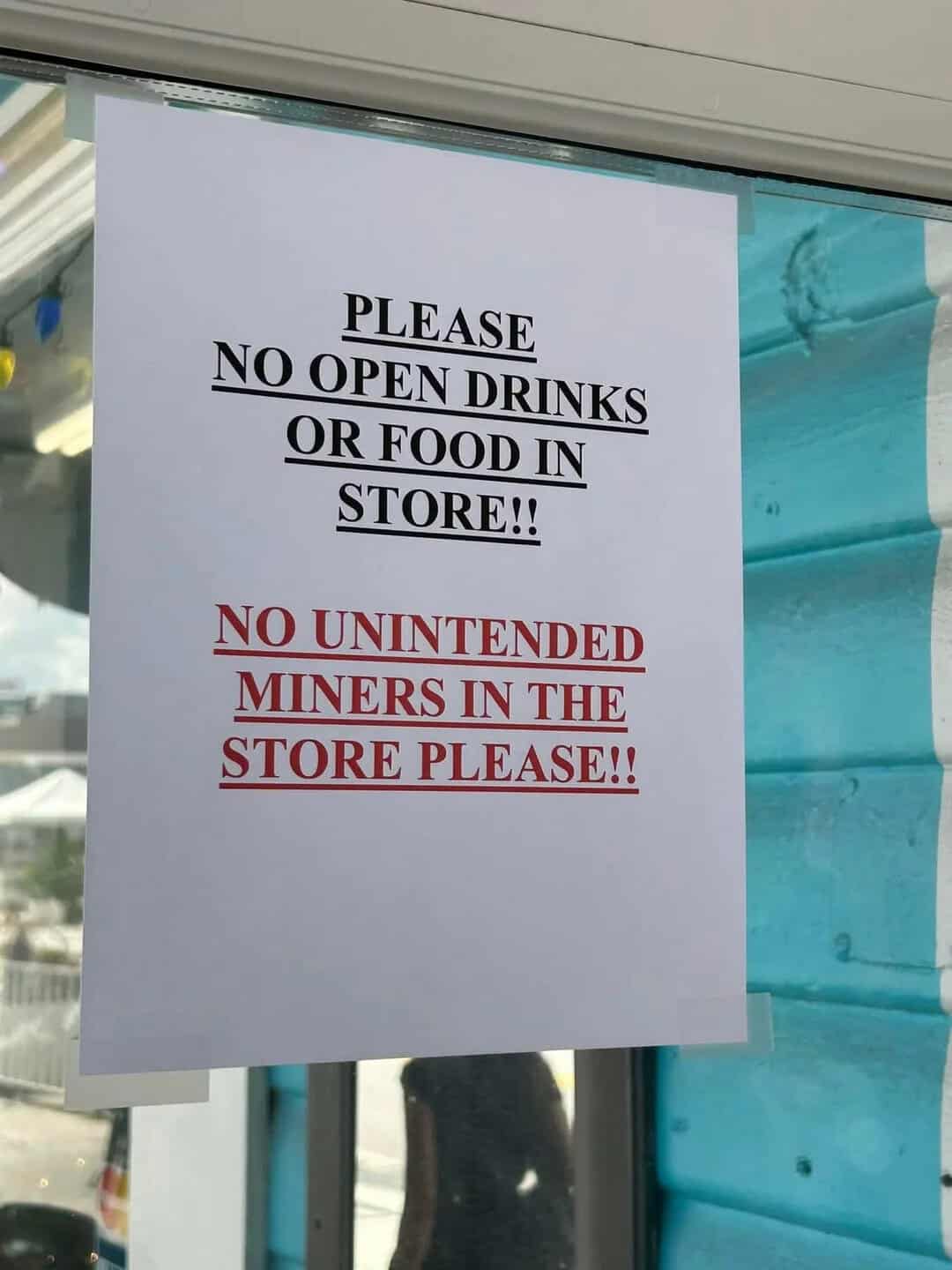 Sign requesting no drinks or food in store, no miners allowed.