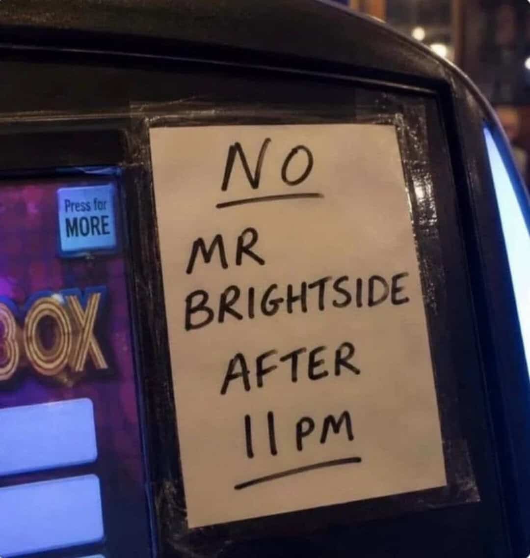 Sign on a vehicle says 'No Mr Brightside after 11 pm'.