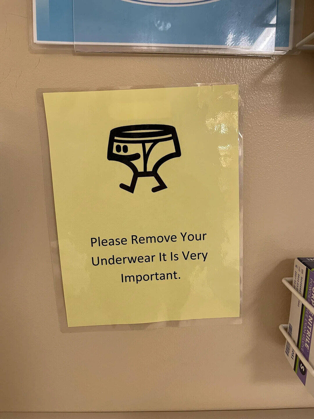 Sign says 'Please Remove Your Underwear It Is Very Important' with a cartoon underwear icon.