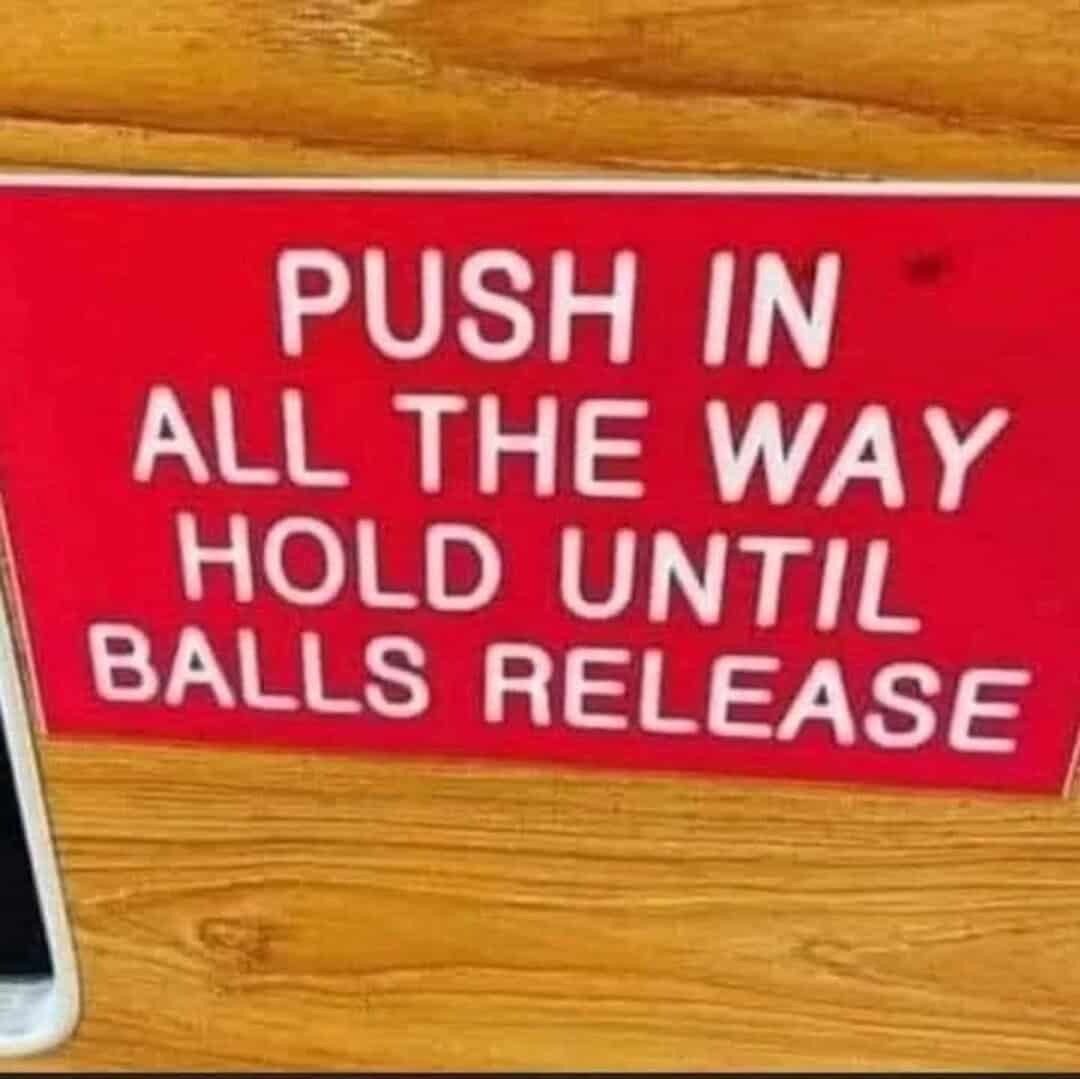 Push in all the way, hold until balls release sign.