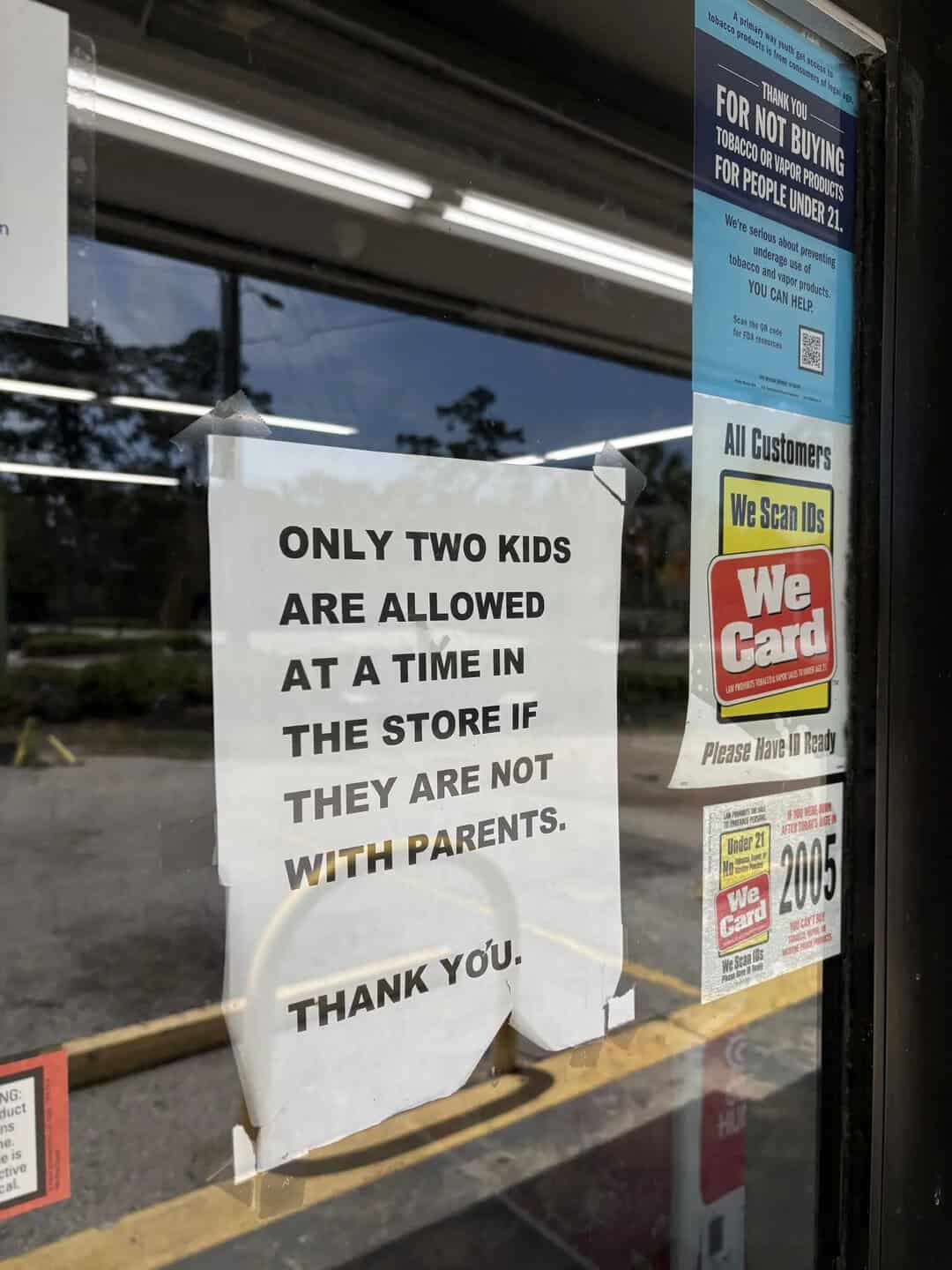 Sign says only two kids allowed in store if not with parents.