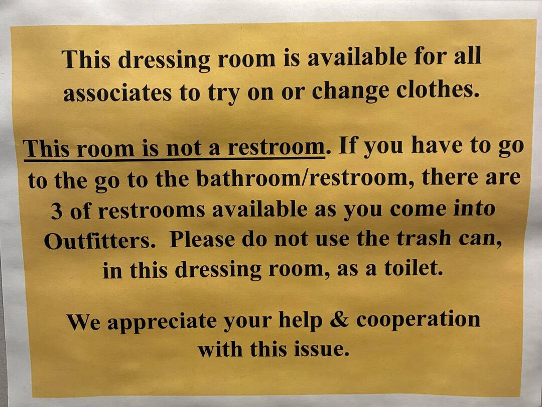 Sign about dressing room and restroom rules, with humorous tone.