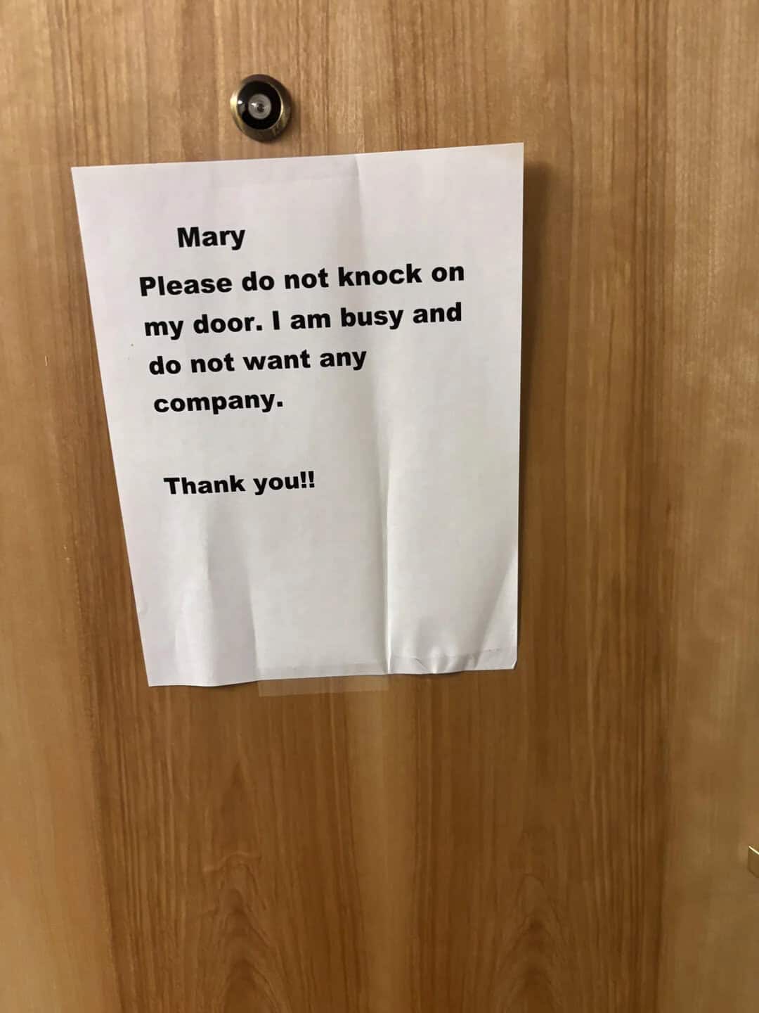 Sign on door says: Mary Please do not knock on my door. I am busy and do not want any company. Thank.