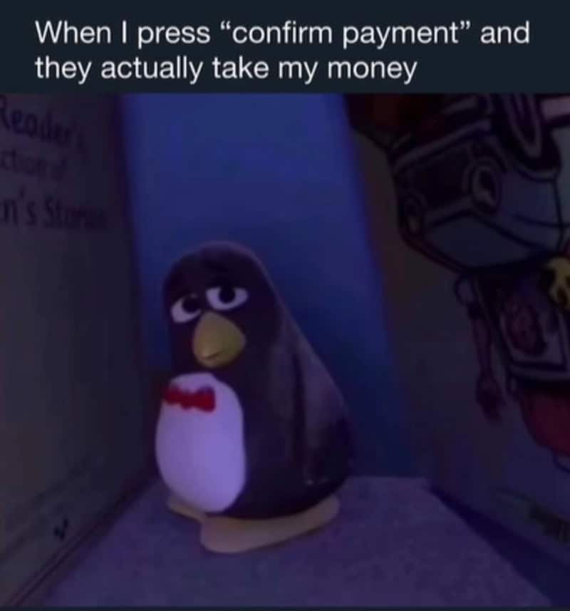 Penguin plush toy with a red bow tie, looking sad, with text about payment confirmation.