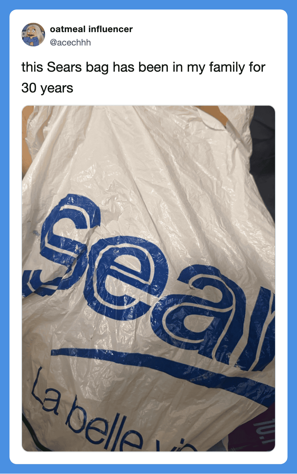 Sears bag in plastic with "Sears" logo and "La belle vie" text.