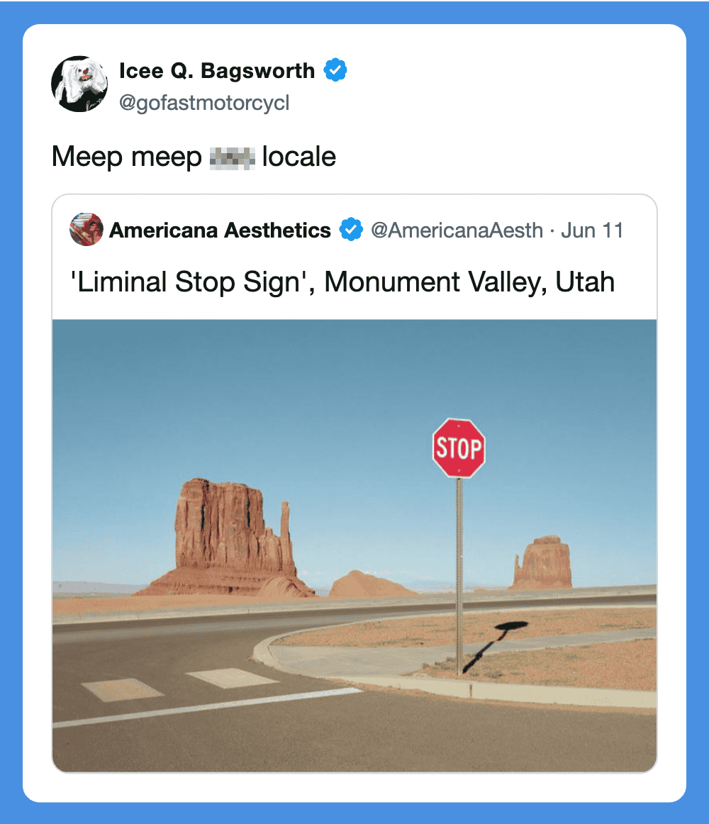 STOP sign at Monument Valley, Utah with desert landscape and rock formations in background.