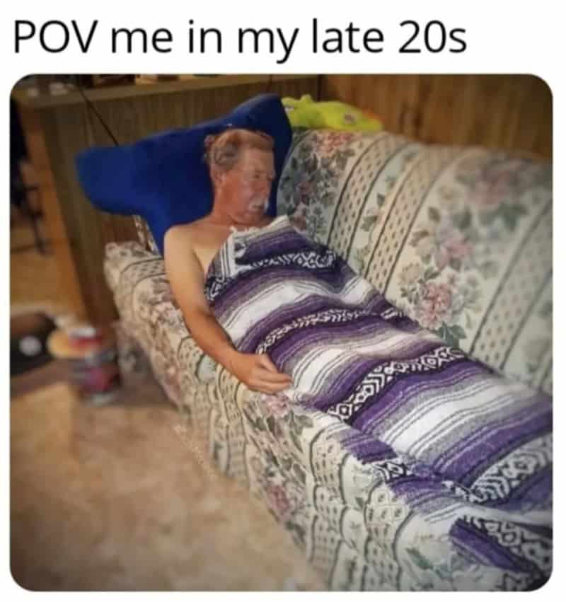Person with a distorted face sleeping on a floral couch with a blanket, captioned 'POV me in my late.
