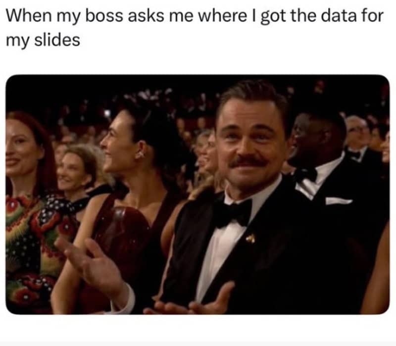 Man in tuxedo at an award ceremony, smiling and clapping.
