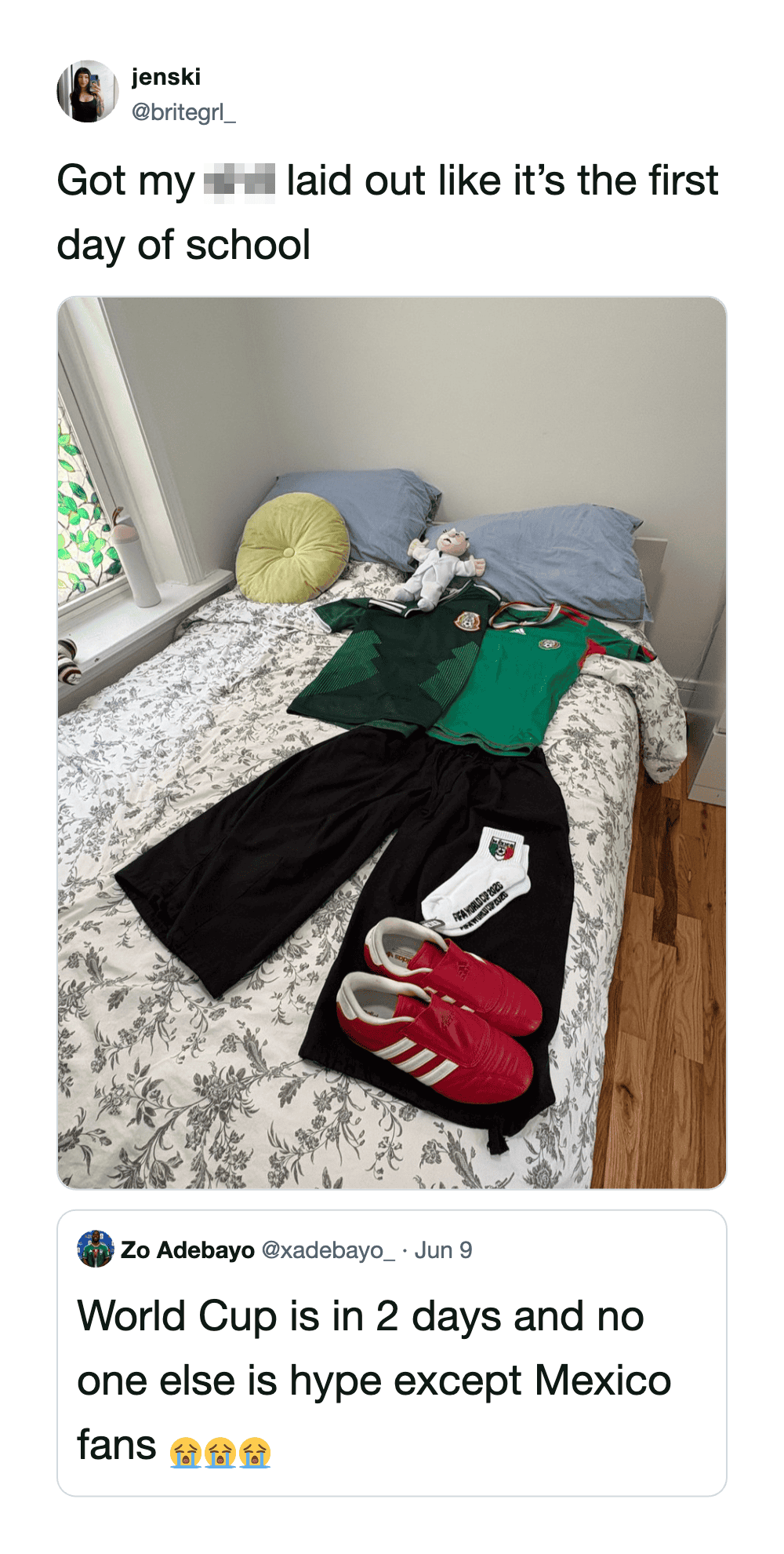 School supplies and clothes on a bed, ready for the first day of school.