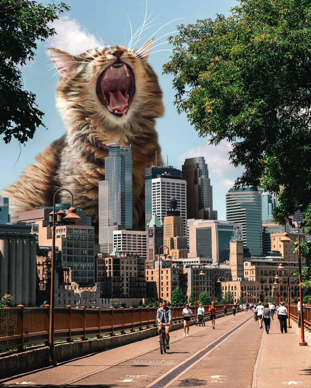 Giant cat roaring over city skyline with people walking on bridge.