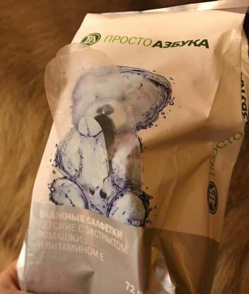 Package of baby wipes with a distorted bear illustration and Russian text.