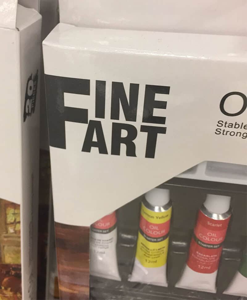 FINE ART paint tubes on a shelf, with a label that reads 'FINE ART'.
