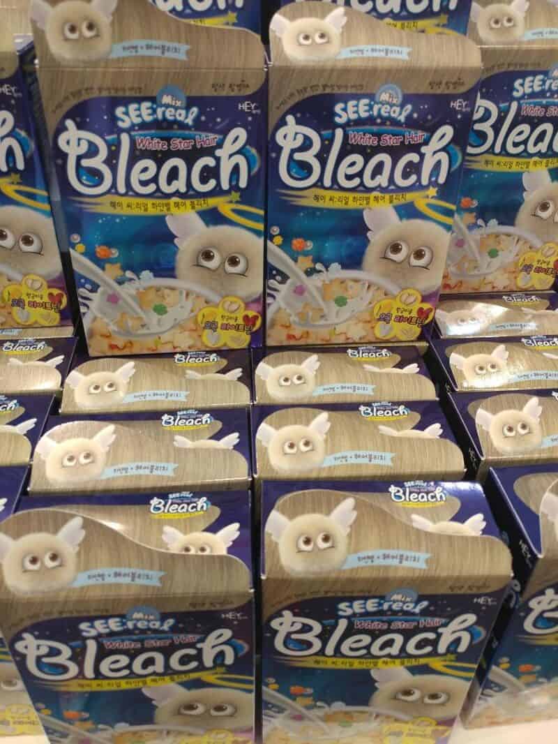 Cartons of Bleach with a cartoon sheep mascot and a white star logo.