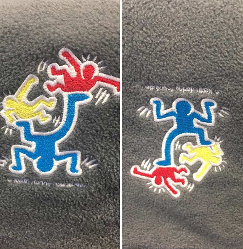 Colorful embroidered design of a blue figure with a yellow and red creature.