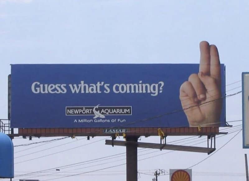 Billboard for Newport Aquarium with a hand making a finger gun gesture.