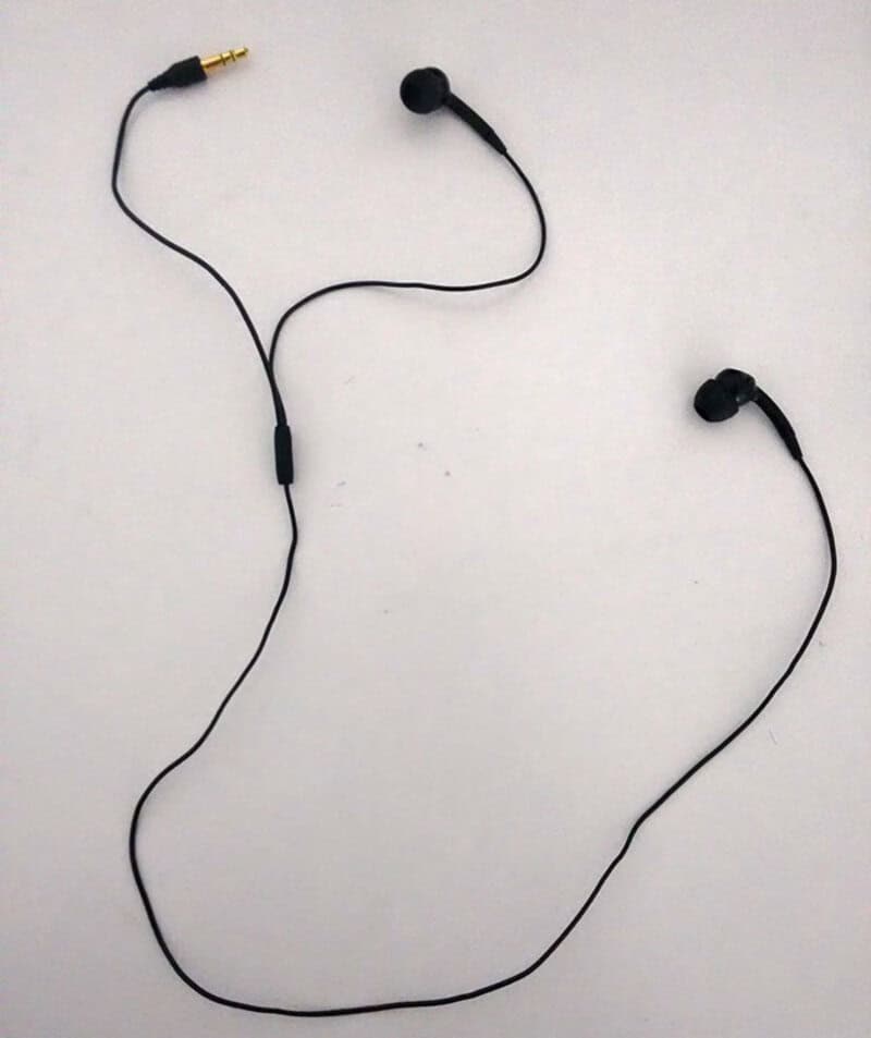Earphones with one earpiece upside down, creating a humorous design fail.