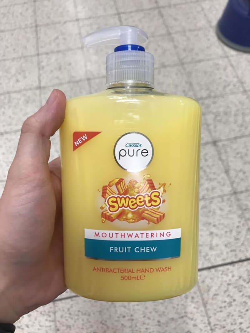 Yellow hand wash bottle labeled 'Sweets' with 'Mouthwatering Fruit Chew' and 'Antibacterial Handwash.