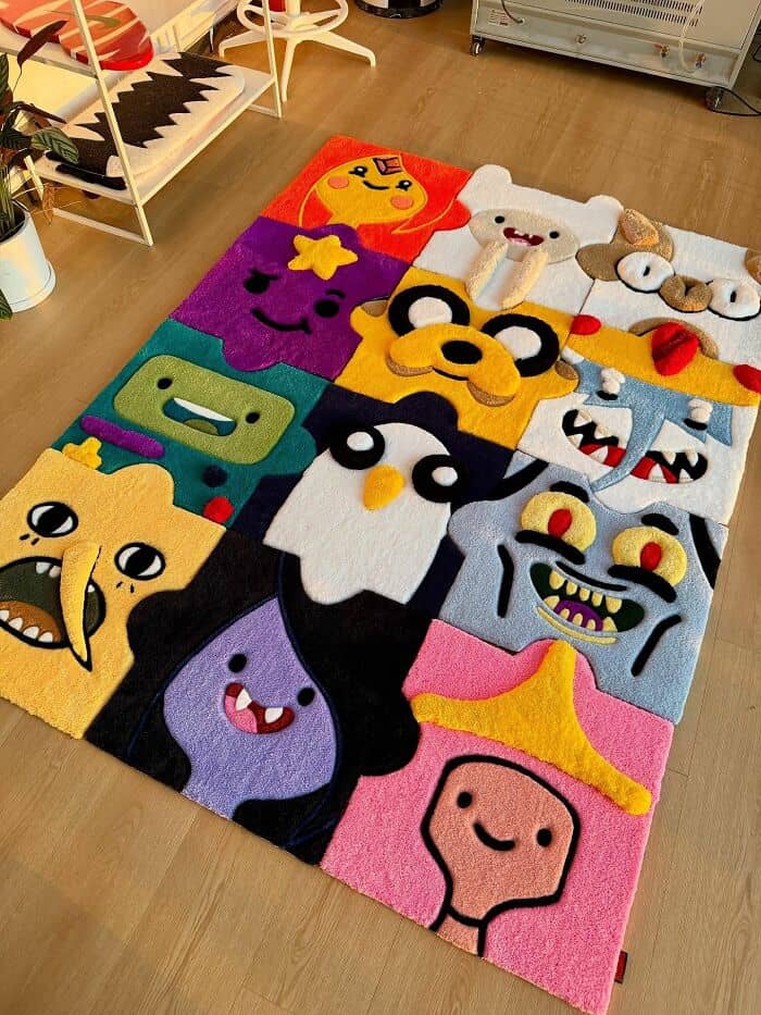 Colorful cartoon character rug with various whimsical faces and designs.